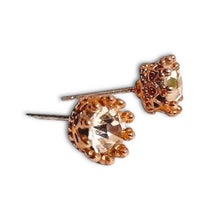 Little Crowns Studs with clear center stone and ornate gold-plated prongs.