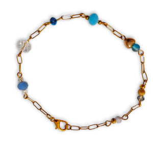 Blue Crystal Gold Tone Linked Bracelet with paperclip chain and lobster claw clasp.