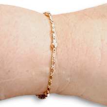 Rose Gold Dainty Bracelet on wrist, 18k rose gold, adjustable length.