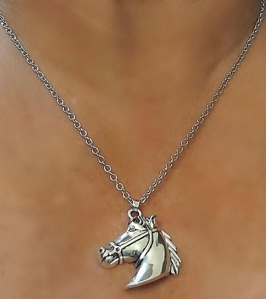 Horse head Silver Necklace on a silver-tone chain.