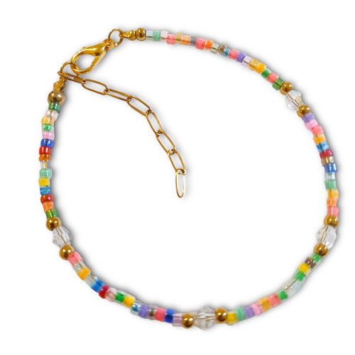 Colorful child-size bracelet with multicolor seed beads and gold stainless steel accents.