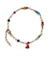 Red Coral Loveheart Bracelet with gold chain, blue agate beads, and heart charm.