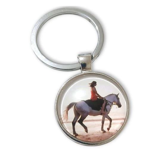 Horse and Rider Cabochon Keyring with beach scene image, glass design, split ring closure.