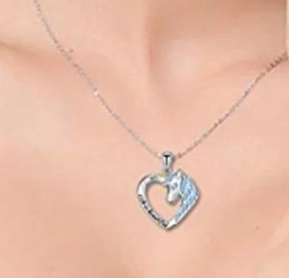 Blue stones love heart necklace with unicorn pendant on silver chain.