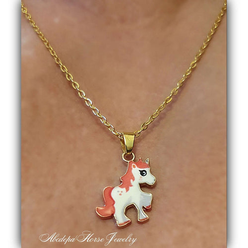 Gold plated pony pendant chain necklace with apricot and white enamel design.