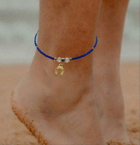 Blue tiny beaded gold horseshoe anklet with crystal details and extension chain.