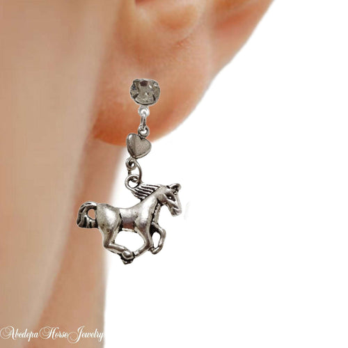 Clear Stone Loveheart Horse Studs on ear with silver horse and loveheart design.