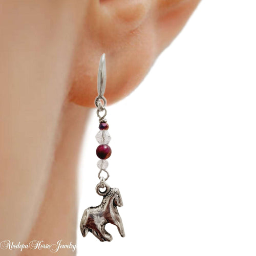 Crystal Gemstone Bead Horse Earrings with silver horse charm, clear crystal bicone, and dragon vein gemstone beads hanging from ear.