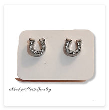 Crystal horseshoe studs with tiny crystal stones and silver metal backing.