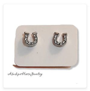 Crystal horseshoe studs with tiny crystal stones and silver metal backing.