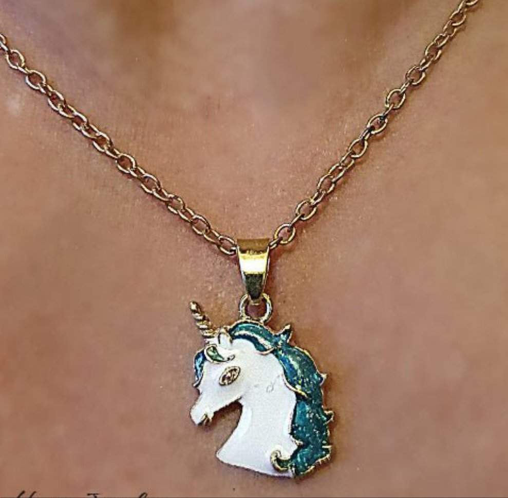 Green Mane Unicorn Necklace with gold chain and green and white unicorn pendant.