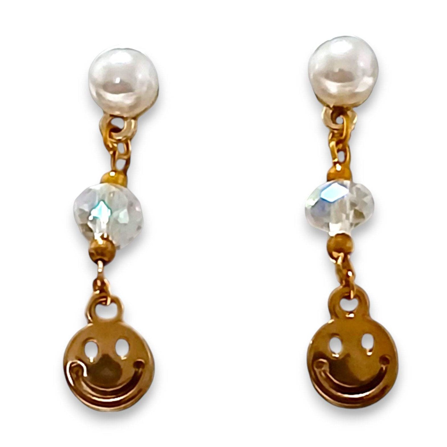 Gold-plated pearl and smiley face earrings with crystals.