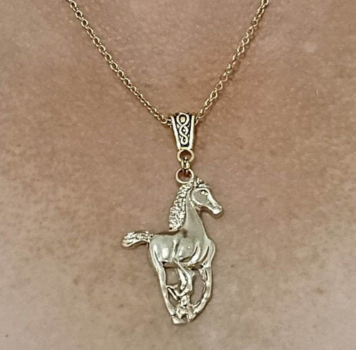 Yellow gold-plated horse pendant galloping necklace on stainless steel chain.