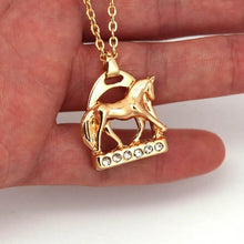 Horse Stirrup with Horse NecklaceHorse Stirrup with Horse Necklace This elegant Horse Stirrup Necklace features a stunning horse doing an extending trot on the base of the stirrup. Adorned with sparHorse Stirrup NecklaceAHJewelryAbcdepaHorseJewelryHorse Stirrup