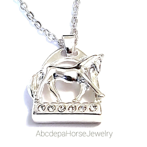 Silver crystal horse stirrup necklace with pendant and 55 cm snake chain.