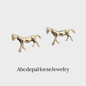 Gold plated stud earrings shaped like trotting horses, 1cm size, from AbcdepaHorseJewelry, in gift-ready bag.