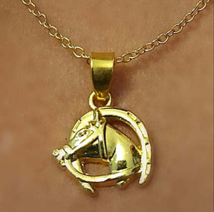 Horseshoe pendant necklace with horsehead design.