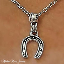 Horseshoe Charm Pendant - on silver chain necklace.