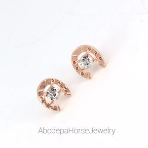 Horseshoe Crystal Gold StudsHorseshoe studs with Crystal in the middle the size
are 1.5cm W X 2cm H and are ideal as a gift for any
one who loves horses with the crystal giving them the extra 
Horseshoe With Crystal In The Middle StudsAHJ SuppliersAbcdepaHorseJewelryHorseshoe Crystal Gold Studs