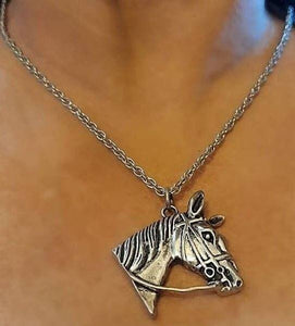 Large Horsehead Pendant Necklace made of silver with bridle details, hanging on a stainless steel chain.