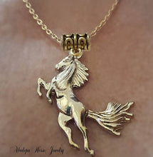 Leaping Gold Horse Pendant Necklace on stainless steel chain.