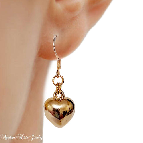 Gold loveheart earrings with silver 925 hooks and 2cm drop.