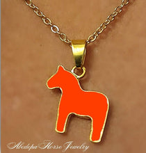 Orange Pony Pendant Necklace with gold chain and lobster claw clasp.