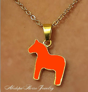 Orange Pony Pendant Necklace with gold chain and lobster claw clasp.