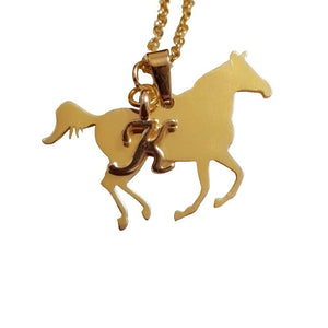 Gold horse cantering necklace with letter charm on stainless steel chain.