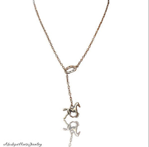 Elegant pull-thru silver horse necklace with horseshoe chain design.