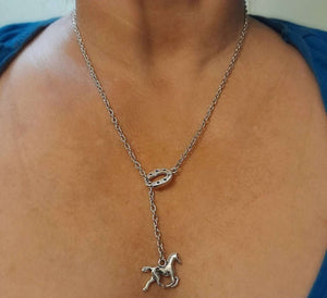 Silver equestrian horse necklace with horseshoe charm.