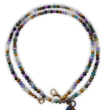 Purple gemstone beaded necklace with metal horse pendant and crystal rondels.