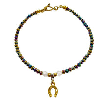 Rainbow Crystal Rondels Gold Horseshoe Bracelet with antique gold toggle clasp and clear crystal accents.