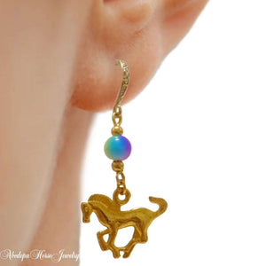 Gold-toned earrings with cantering horse and rainbow ceramic bead on hook shape.