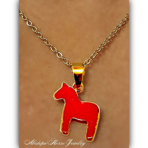 Red Pony Necklace with red and gold pendant, 55cm length, stainless steel chain.