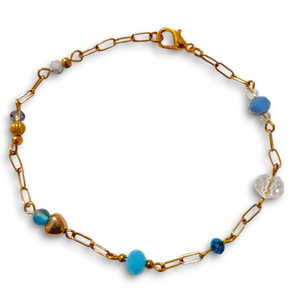 Blue Crystal Gold Tone Linked Bracelet with stainless steel paperclip chain and crystal beads.