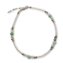 Amonizite anklet with green and blue gemstones, purple jade, crystal beads, silver rondels, gold stainless steel beads, and lobster claw clasp.