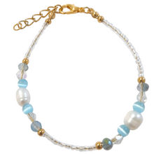 Pearl seedbead bracelet child size with real pearls, crystal clear bicone, blue rondels, and gold stainless steel beads.