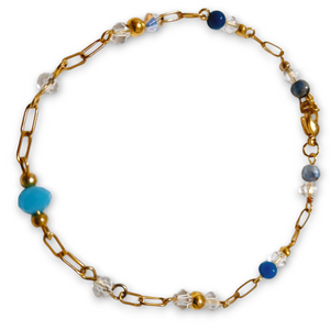 Gold tone crystal gemstone bracelet with blue and clear crystal rondels, Sodalite, and Blue Agate beads on a paperclip chain.