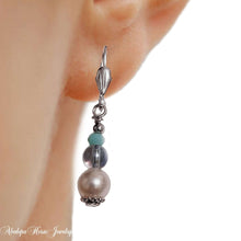 Silver bead dangle earrings set with matching bracelet.