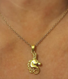 Unicorn pendant necklace - with gold mane on stainless steel chain.