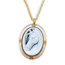 White Horse Oval Pendant Necklace with gold stainless steel and grey background.